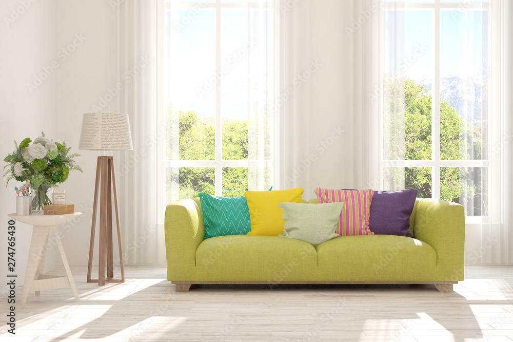 Fototapeta premium Stylish room in white color with sofa and summer landscape in window. Scandinavian interior design. 3D illustration