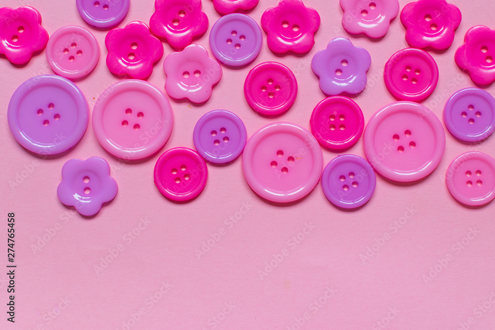 Various pink sewing buttons on light pink background Various pink sewing buttons on light pink background