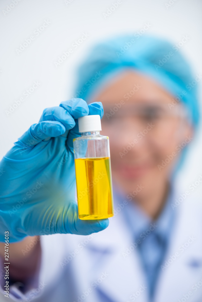 The scientist test the natural product extract, oil and biofuel solution, in the chemistry laboratory. The scientist test the natural product extract, oil and biofuel solution, in the chemistry laboratory.