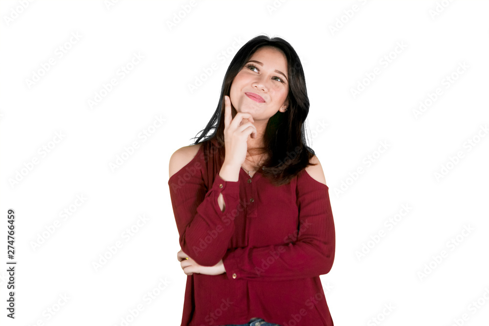 Happy woman thinking something on studio Happy woman thinking something on studio