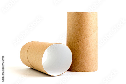 Two cardboard paper tubes on white background. Close-up of empty toilet rolls photo