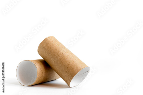 Close-up of empty toilet rolls. Two cardboard paper tubes on white background. Copy space