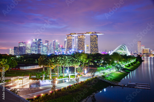 SINGAPORE  SINGAPORE - MARCH 2019  Vibrant Singapore skyline with Marina Bay Sands  Gardens by the bay with cloud forest  flower dome and supertrees at sunset. Top view from marina barrage