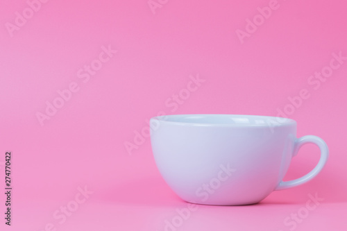 white coffee cup on pink background