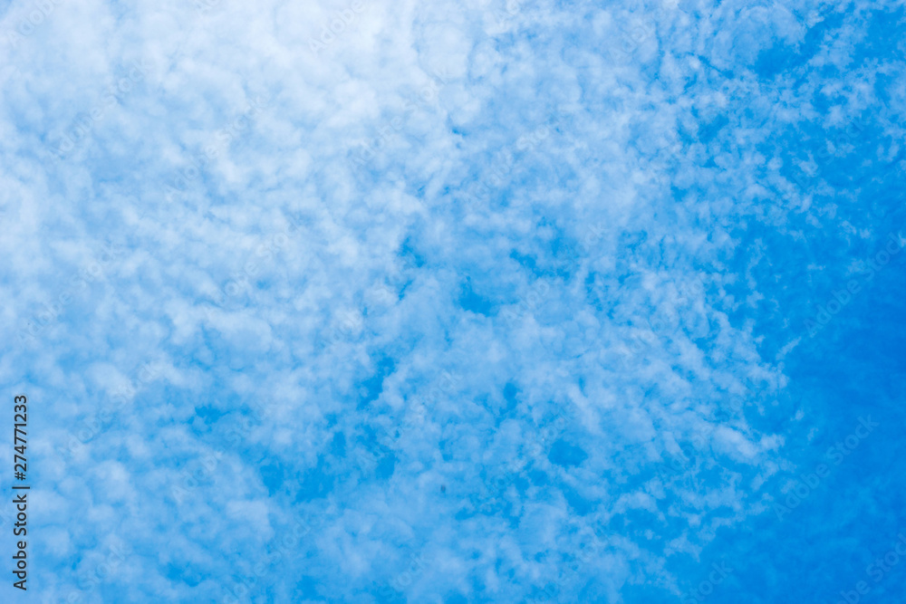 white cirrocumulus clouds on blue sky
