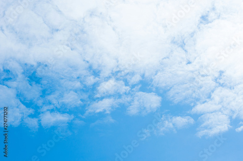 white cirrocumulus clouds on blue sky photo