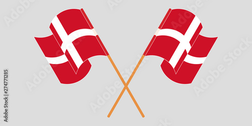 Crossed and waving flags of Denmark photo