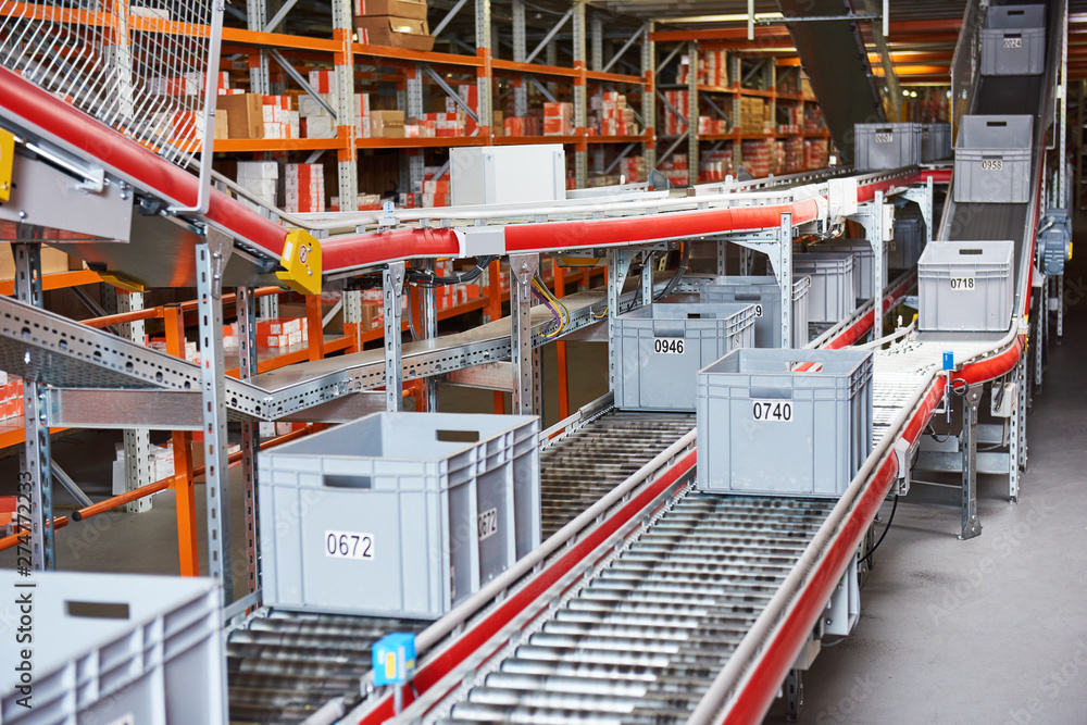 Automated warehouse. Boxes with spare parts moving on conveyer - obrazy, fototapety, plakaty 