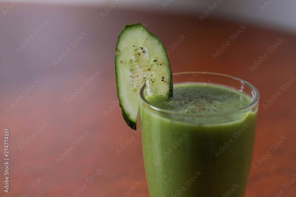 A glass of green fruit and vegetable smoothies A glass of green fruit and vegetable smoothies