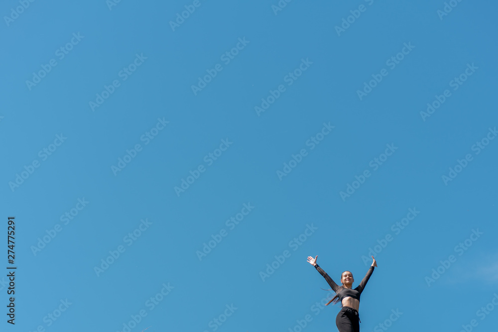 girl in uniform and sunglasses doing sports on the bank of the river. Healthy lifestyle girl in uniform and sunglasses doing sports on the bank of the river. Healthy lifestyle