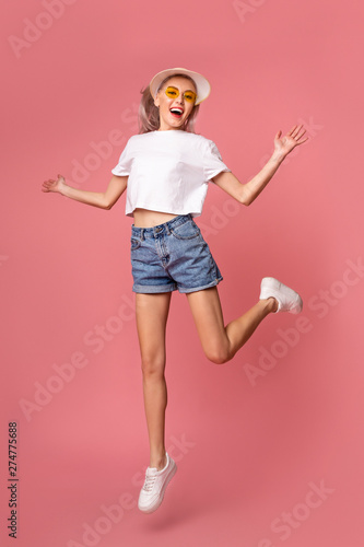 Fashion Girl Jumping on Pink Background, Summer Teen Style