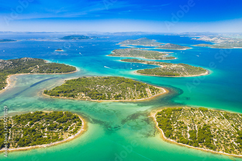 Croatian coast, beautiful small Mediterranean stone islands in Murter archipelago coastline, aerial view of turquoise bays with yachts and boats photo
