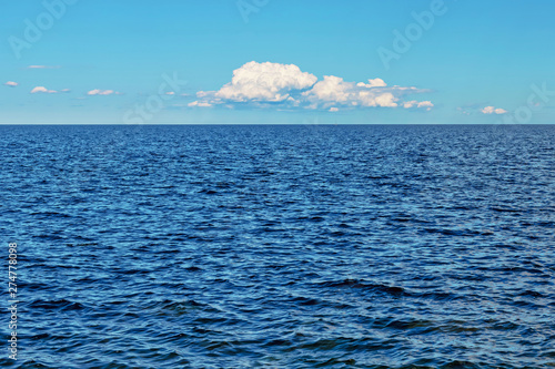 Cloud over a deep blue sea ...