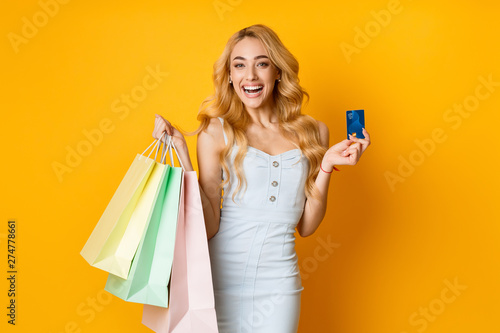 Woman With Colorful Paper Bags And Credit Card