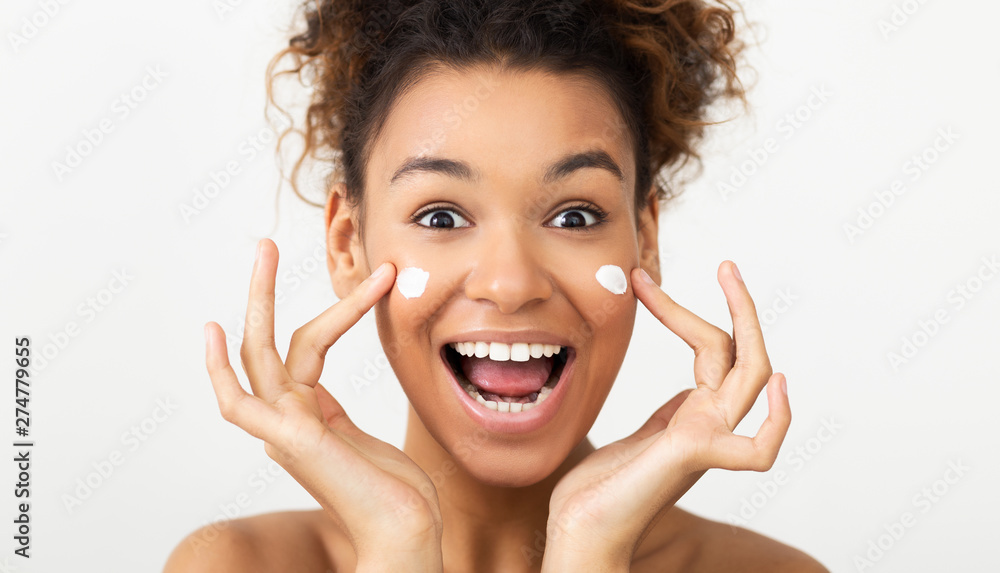 Skin Care. Excited Woman Applying Face Cream Skin Care. Excited Woman Applying Face Cream