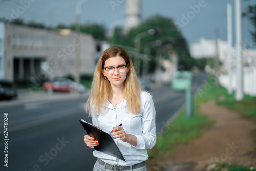 young beautiful woman walk on street spend time on fresh air