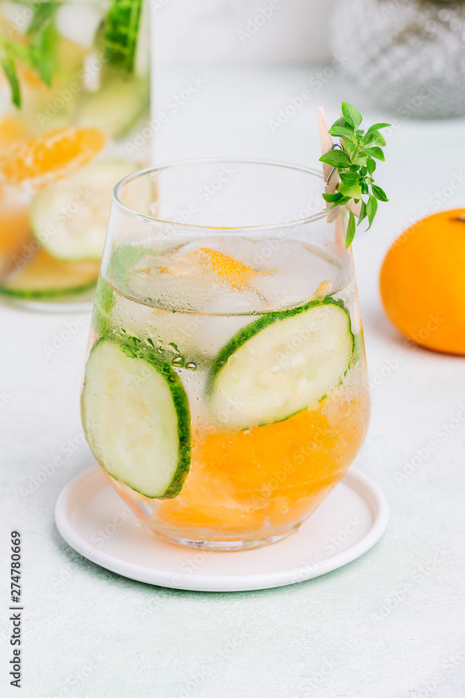 Cold drink with cucumber and citrus at white background Cold drink with cucumber and citrus at white background