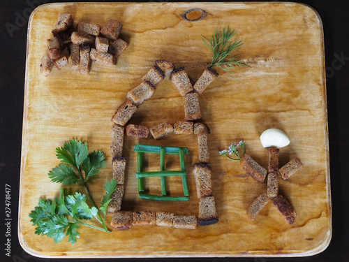 The original picture of rye crackers and herbs for children. Children's entertainment in the kitchen.