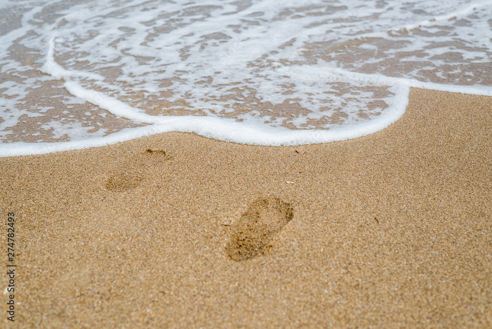 Footprints in the sand on the seashore, the ocean. Footprints in the sand on the seashore, the ocean.