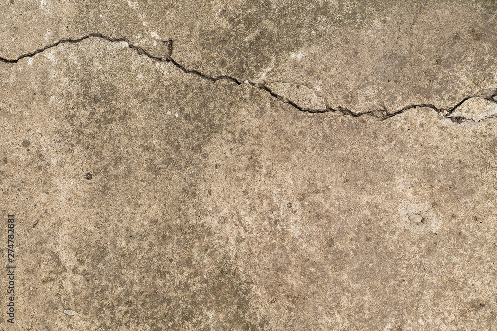 Fototapeta premium Concrete surface, textured with a crack horizontally.