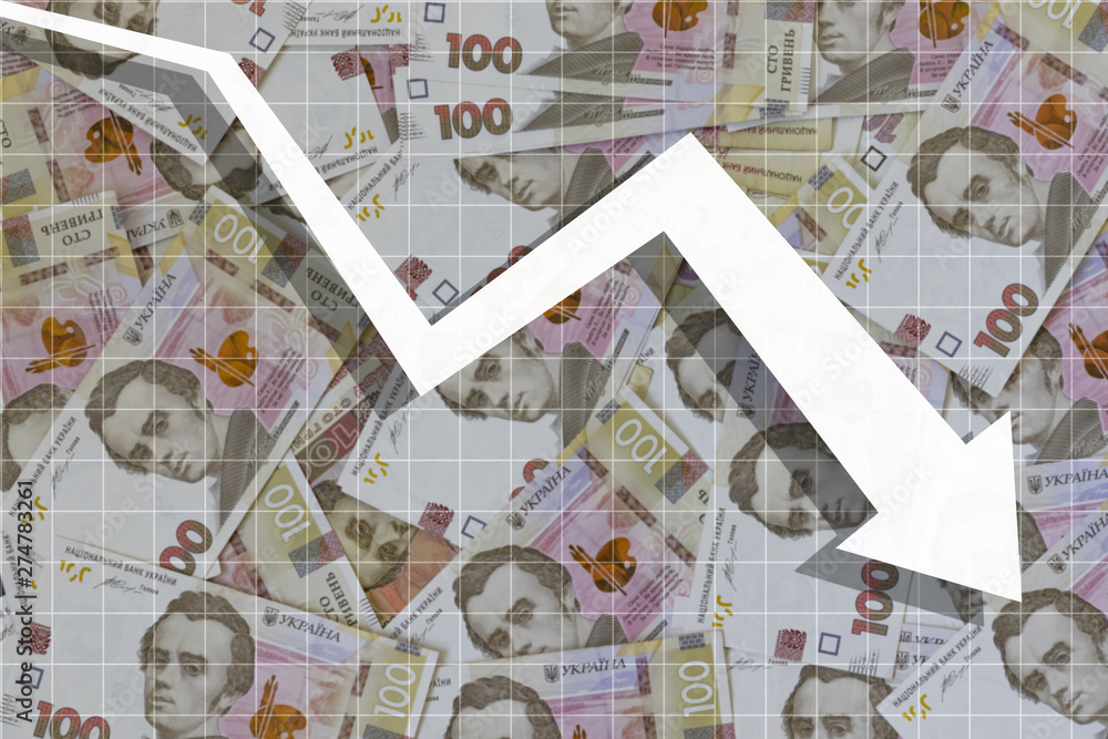 arrow fall down on the background of Ukrainian hryvnia arrow fall down on the background of Ukrainian hryvnia