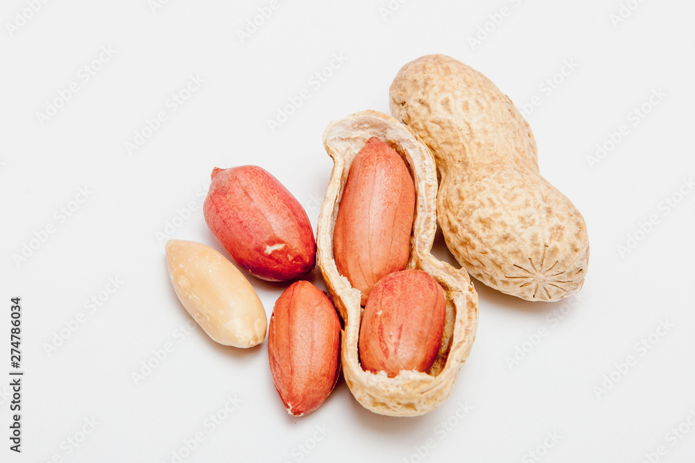 Large peeled peanuts close-up of beans in the shell. Unpeeled peanuts in the shell. Peanuts, for background or texture. Growing organic protein Large peeled peanuts close-up of beans in the shell. Unpeeled peanuts in the shell. Peanuts, for background or texture. Growing organic protein