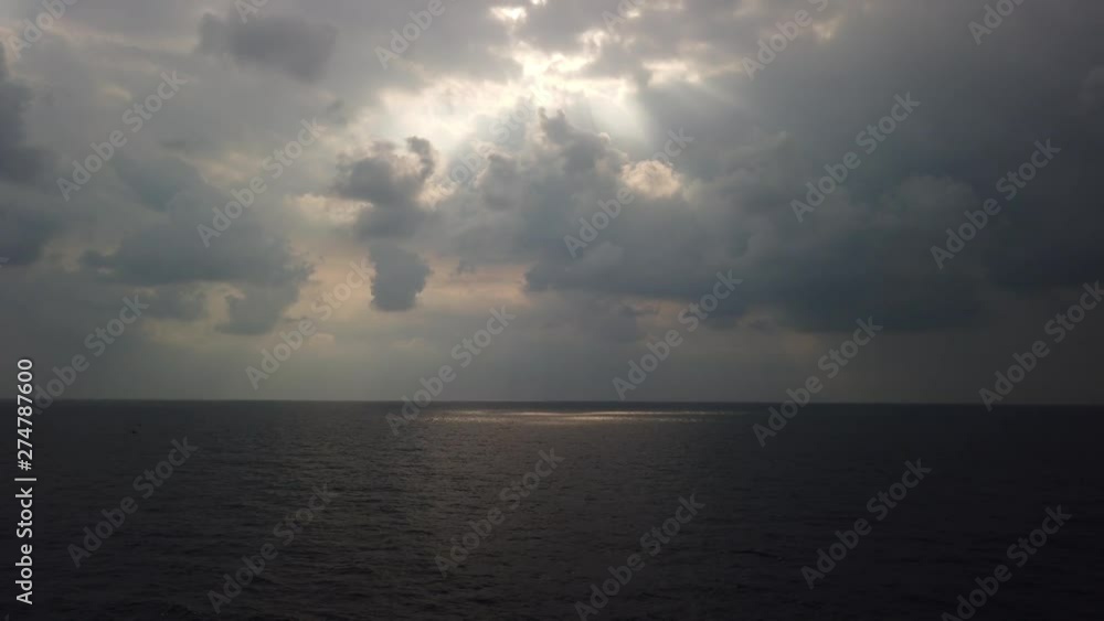 Stormy weather, high wind and wave in the middle of the ocean with dark clouds before storm Stormy weather, high wind and wave in the middle of the ocean with dark clouds before storm