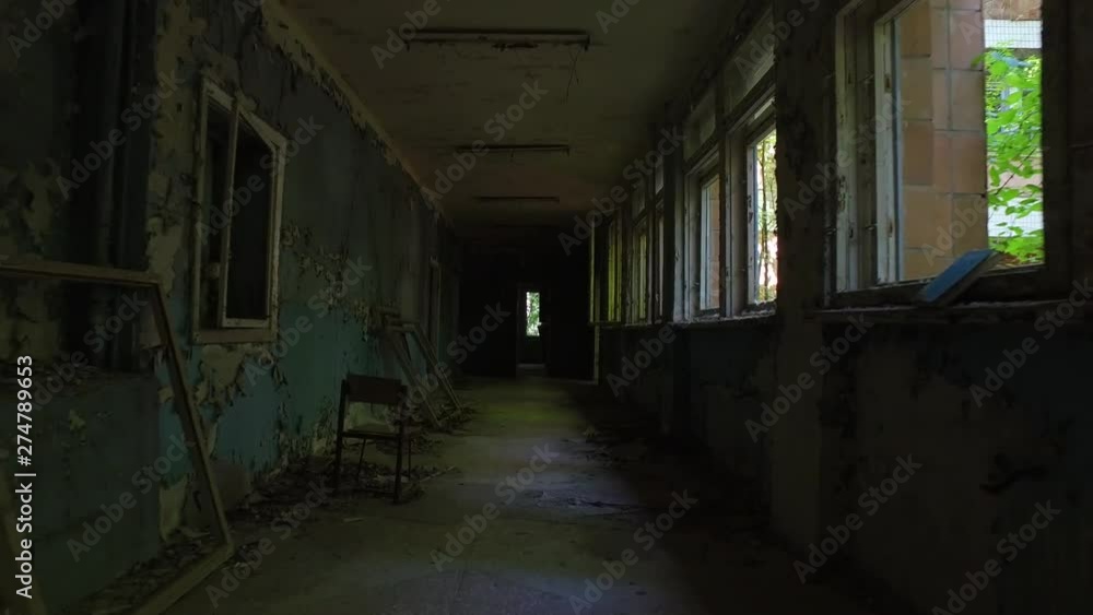 Moving through a creepy corridor in an abandoned building in Chernobyl, Ukraine Moving through a creepy corridor in an abandoned building in Chernobyl, Ukraine