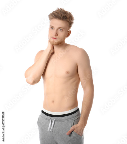 Portrait of young man with slim body on white background