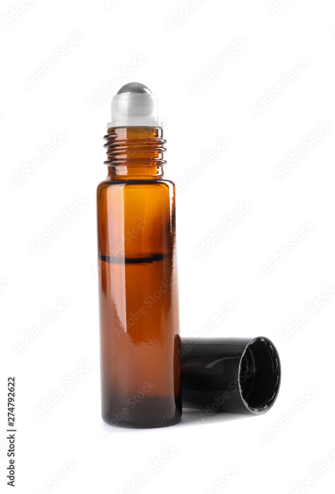 Bottle of herbal essential oil and cap isolated on white Bottle of herbal essential oil and cap isolated on white