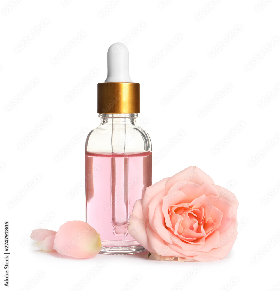 Bottle of rose essential oil and flower isolated on white Bottle of rose essential oil and flower isolated on white