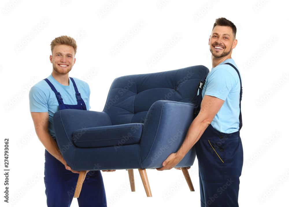 Obraz premium Portrait of moving service employees with armchair on white background
