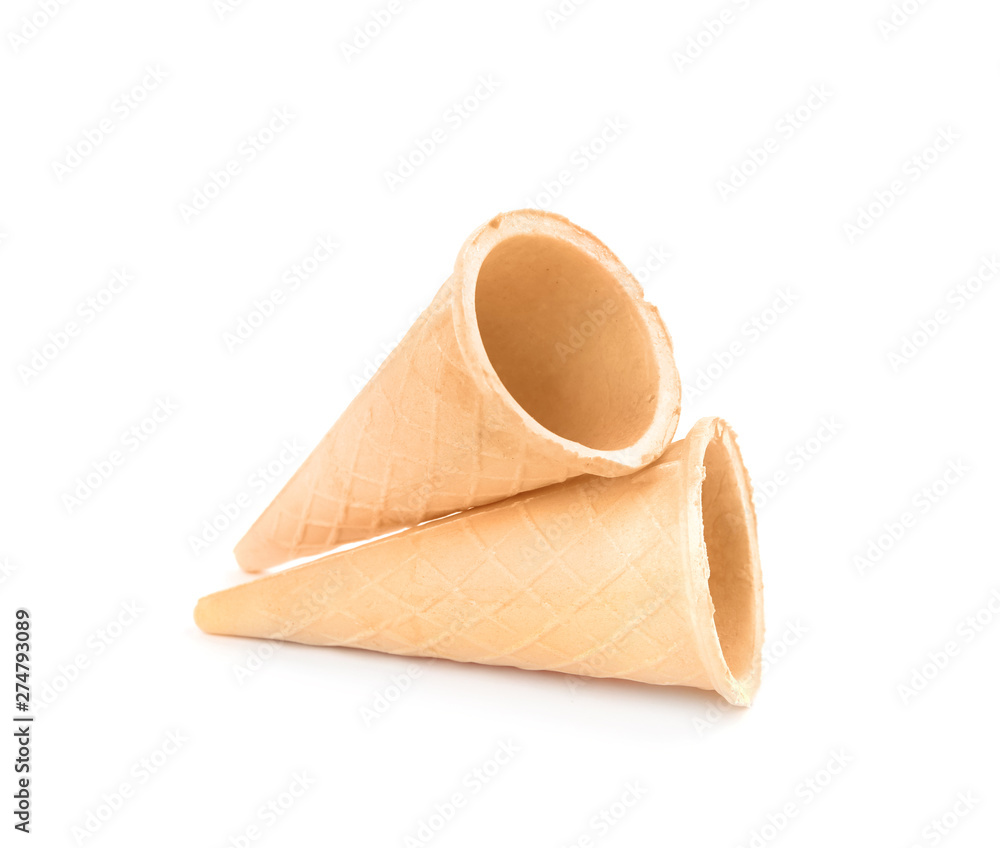 Empty crispy waffle cones for ice cream on white background Empty crispy waffle cones for ice cream on white background