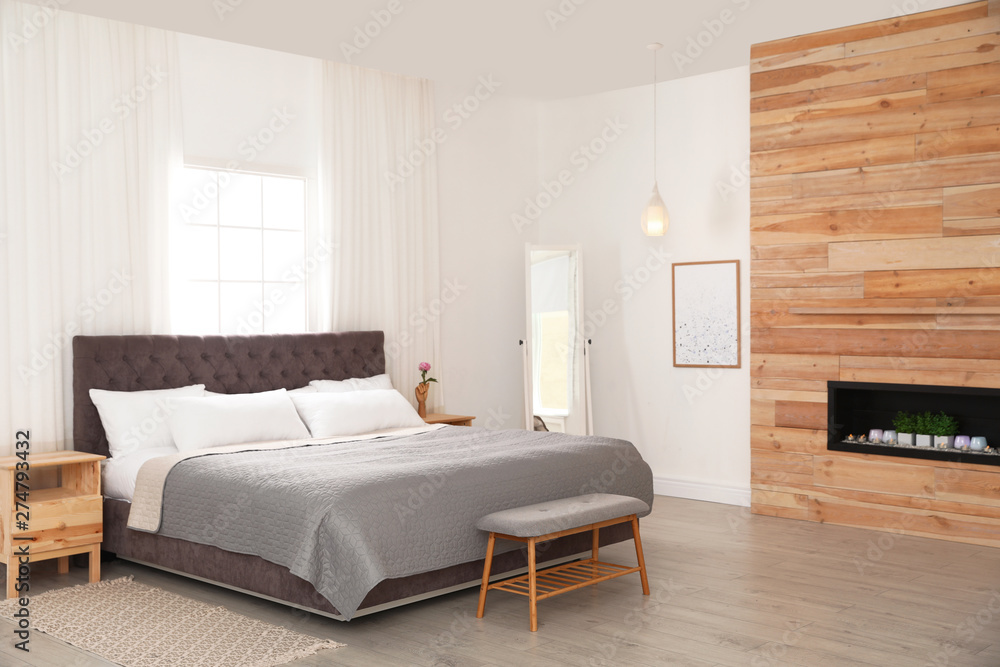 Modern comfortable bed in room. Interior design Modern comfortable bed in room. Interior design