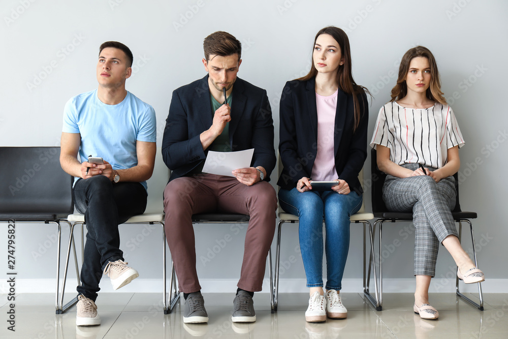 Obraz premium Young people waiting for job interview indoors