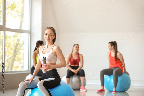 Young sporty woman with fit...