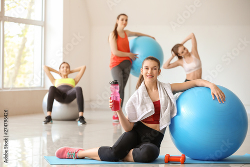 Young sporty woman with fit...