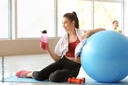 Young sporty woman with fit...