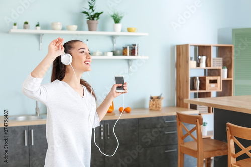 Beautiful woman listening t...