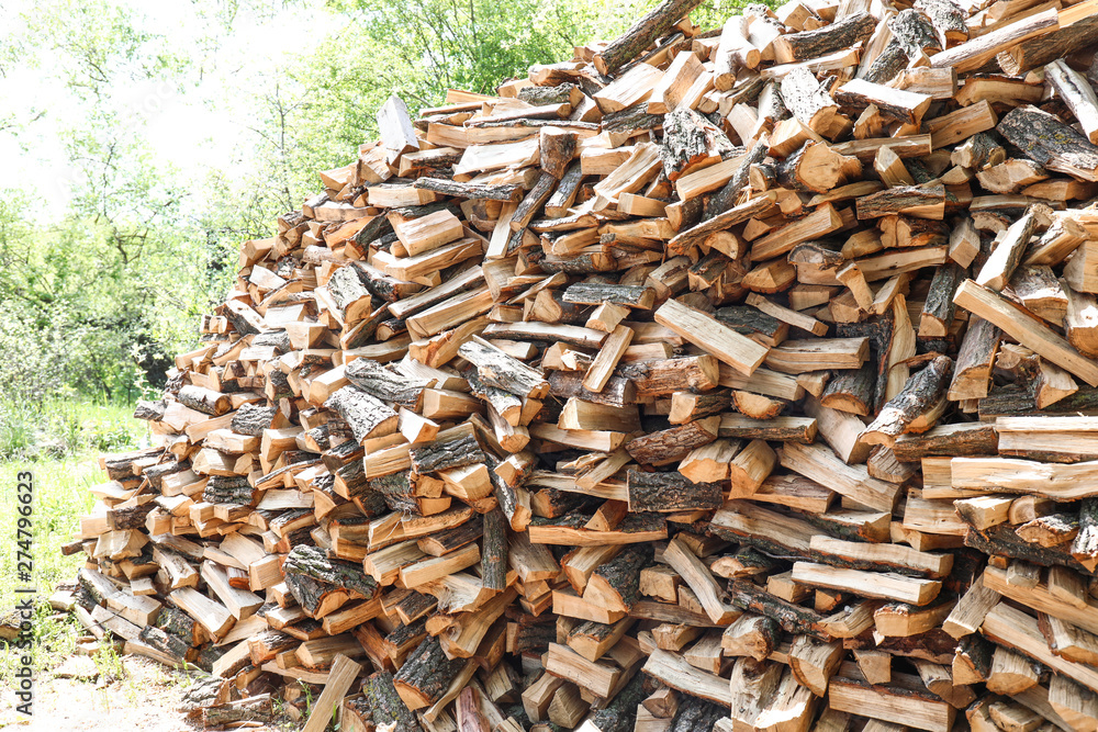 Pile of chopped fire wood prepared for winter outdoors Pile of chopped fire wood prepared for winter outdoors