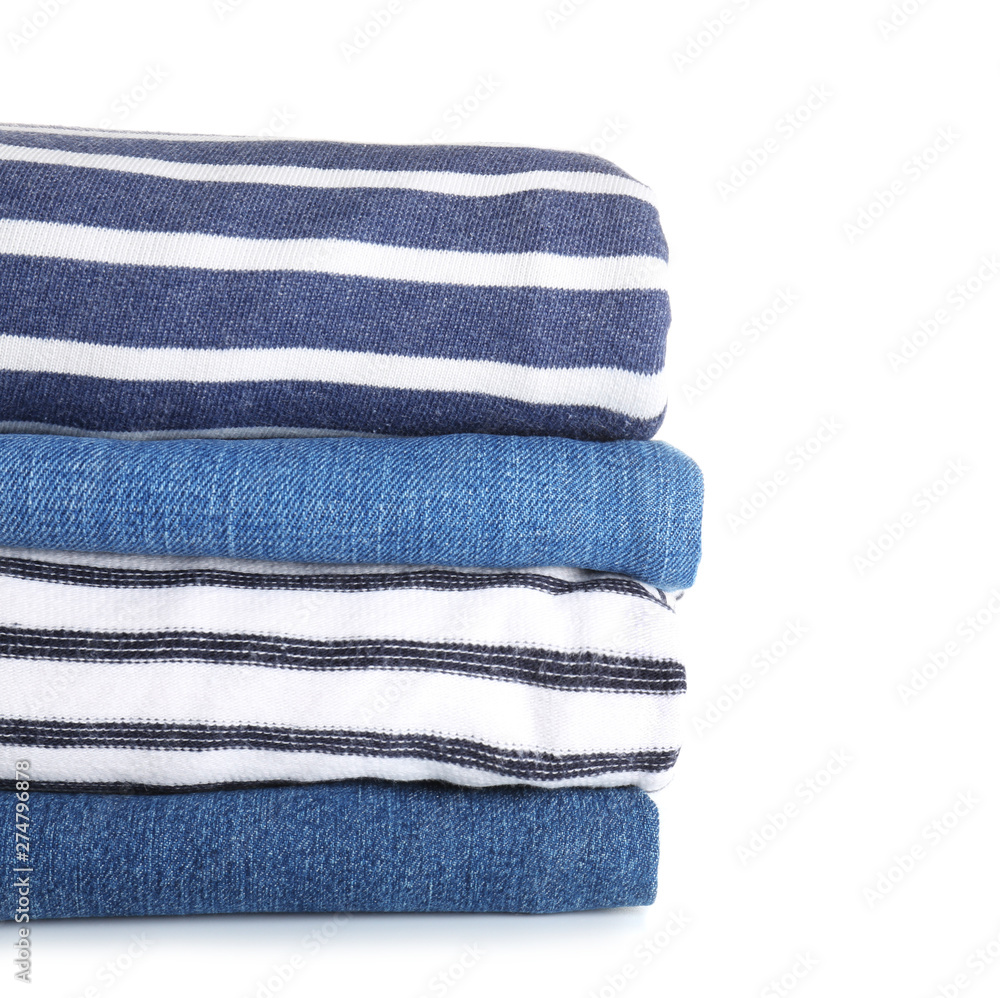 Stack of modern clothes on white background Stack of modern clothes on white background