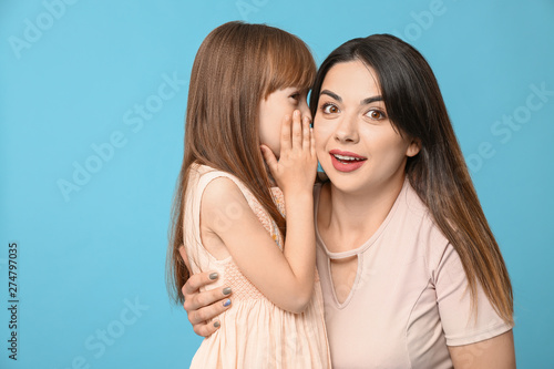 Little girl telling mother ...