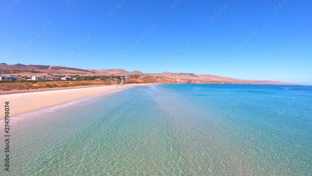 Drone aerial view of Australian wide open beach and coastline, taken at Sellicks Beach, South Australia.