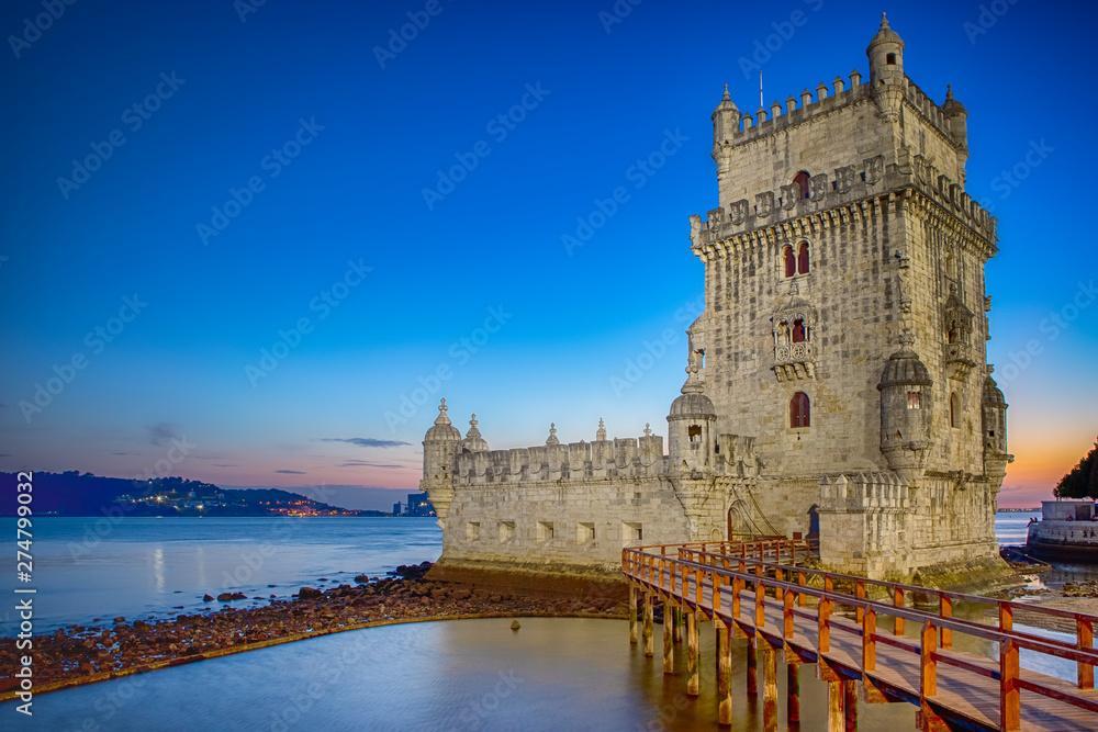 Famous Ancient Belem Tower on Tagus River in Lisbon at Blue Hour in Portugal.