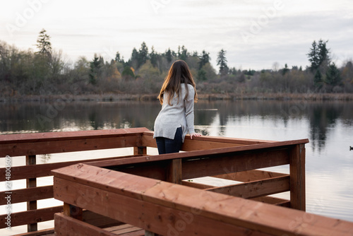 Young woman at a dock © Bogdan