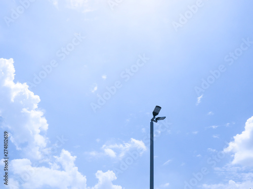 street lamp on blue sky with clouds