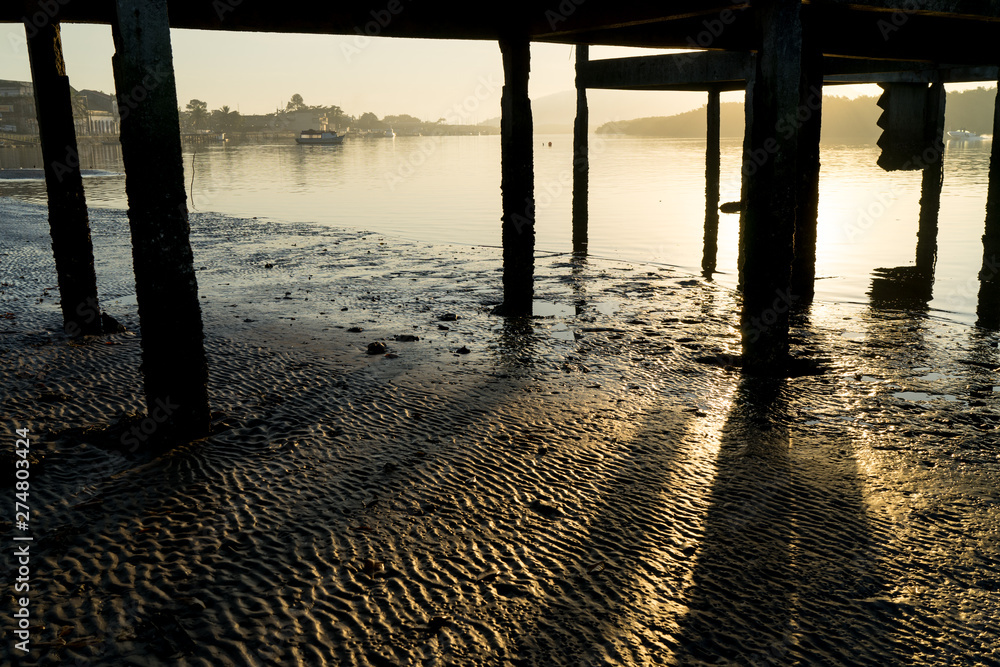 Dawn in Ancient Pier In Paranaguá, Brazil with amazing sunlight 