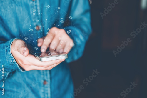 Businessman using mobile online icon social networking connection on screen photo