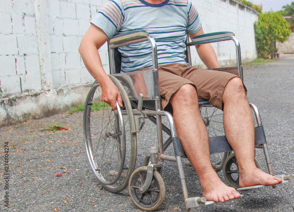 Obraz premium Disabled man is wheelchair at street.concept