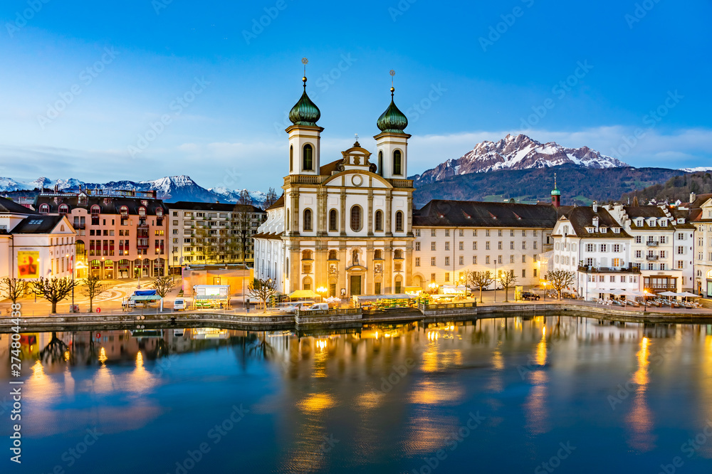 Panoramic view of Lucerne with the bridge Kapellbrucke, Wasserturm Tower and the Church of the Jesuits, Lucerne, Switzerland.